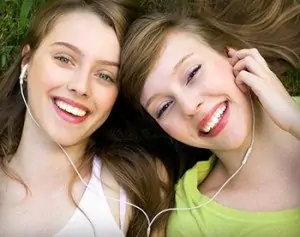 Girls from Charlotte show off their good oral hygiene thanks to general dentistry treatments at Advanced Dentistry of Charlotte.