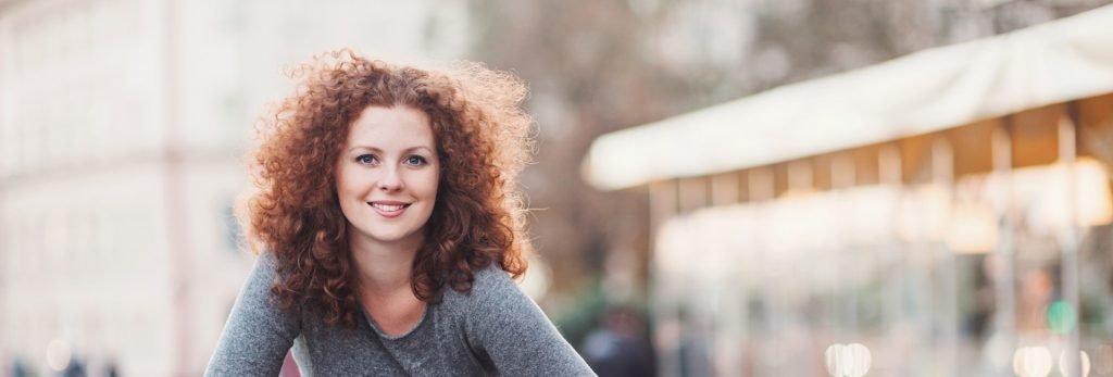 Smiling woman with excellent dental hygiene in Charlotte.